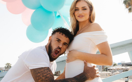 cory and taylor in their gender reveal event 